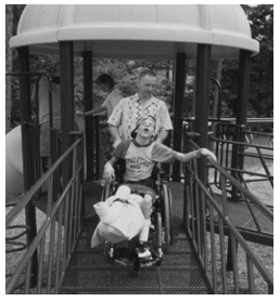 In this figure we observe one person help to wheelchair use children for access to elevated accessible route.