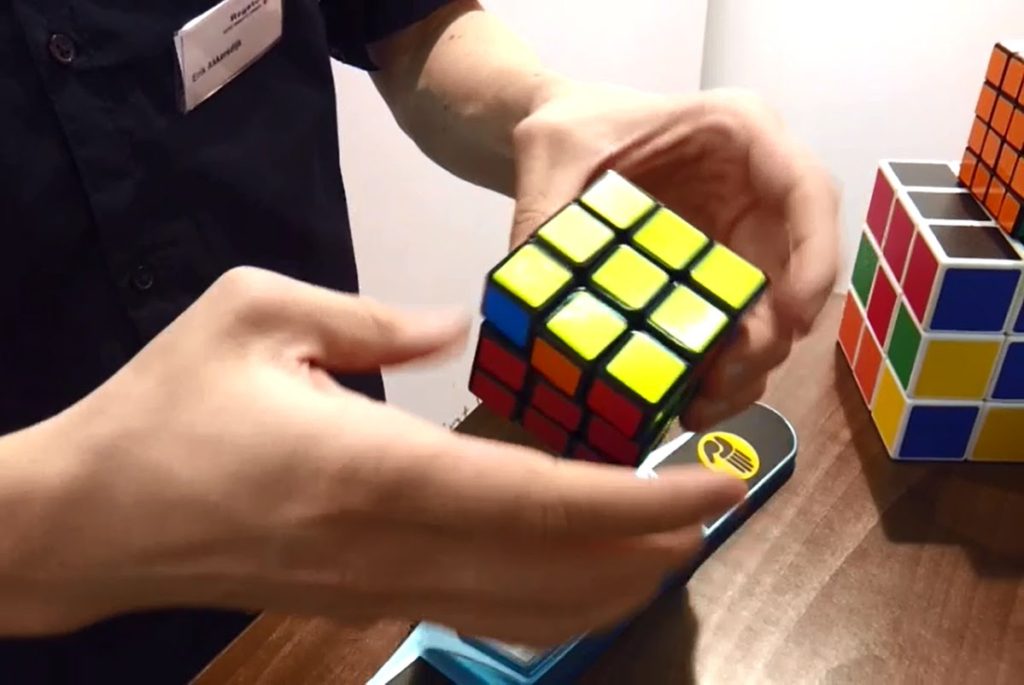 A person playing with Rubik's cube